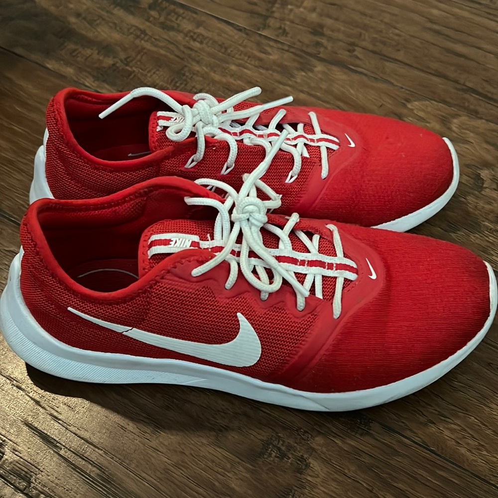 Red Nike shoes lightly used